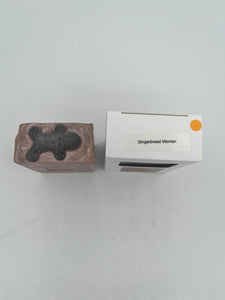 Pine and Bedford's Gingerbread soap bar.  The top embellishment (a Gingerbread Man) is shown here on the left. The right side shows the box with a label identifying the embellishment choice.  Eg. Gingerbread woman 