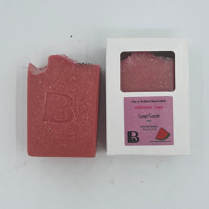Pine and Bedford's Watermelon Sugar soap is made with Watermlon Juice, Rose Clay, Organic Coconut Oil, Sunflower Oil, Organic Extra Virgin Olive Oil, RSPO Palm Oil, Mango Seed Butter and Castor Oil.  It is topped with pink sugar crystals and poppy seeds.  The fragrance is that of a light  fresh watermelon.  Shown here naked and boxed. 