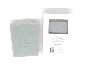 Pine and Bedford's Liberty blue soap, fragrance-free and made with Blue Cambrian Clay, shown naked and boxed.