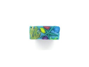 Pine and Bedford's Ocean bar soap contains Sea Moss and has a fresh ocean scent. The top is embellished with Glycerin soap in the shape of Yellow Sea Moss, brightly coloured sea shells and a star fish.