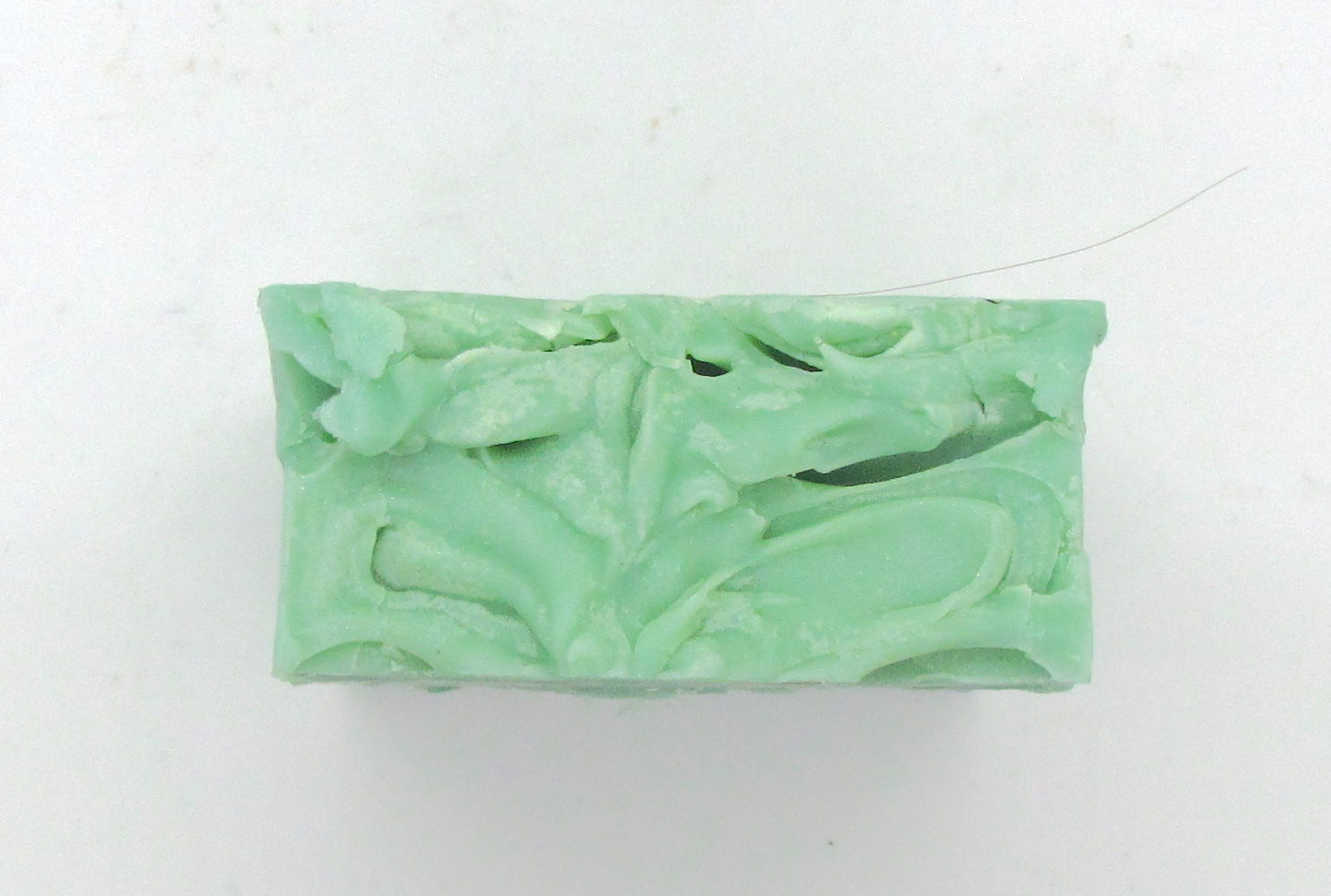 Pine and Bedford's Signature soap is a medium green with  a beautiful pine fragrance. The top is swirled in the spirit of a heavy bark.  (Top view shown here)